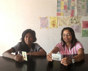 In Sri Lanka, Gayani (left) holds the old laminated paper ID and Rangala holds a new smart ID