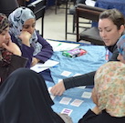 Shaylyn Romney Garrett with students in Jordan