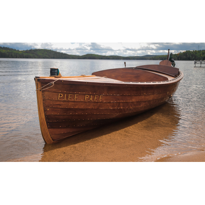 Small, old-fashioned, wooden-made boats, and many are coming to